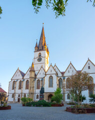 Poster - Sunrise view of Saint Mary cathedral in Romanian town Sibiu