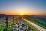 Fototapeta Krajobraz - Stone footpath and wooden fence leading a long The Great Ridge in the English Peak District