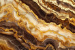 An intricately patterned gold marble, where layers of gold, chocolate, and ivory intertwine, evoking the richness and complexity of a gourmet dessert. 32k, full ultra HD, high resolution