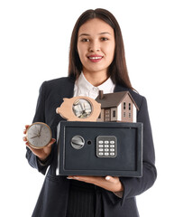 Sticker - Young happy Asian woman with safe box, piggy bank and model of house isolated on white background