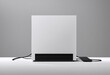 A minimalist setup featuring a blank white game play console sleek design computer on a white surface against a gray background.