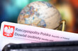 A globe and Polish identity card