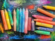 Whimsical Children's Chalk and Crayon Art: Playful Creations in Pink, Green, Blue, and Orange