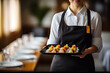 © KirKam - Professional Waitress Serving Gourmet Appetizers at a High-End Restaurant
