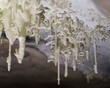 Intricate Icicle Formation in Cave During Winter Season