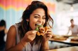 Woman's face eagerly anticipating the first bite of a Poke Taco, with eyes locked on the mouth-watering dish, against a soft-focus backdrop