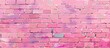 A close up of a purple brick wall with graffiti on it. The rectangular brickwork has a pattern of violet, magenta, and pink colors in the font
