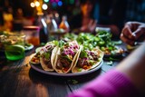 Fototapeta Zwierzęta - 
Candid snapshot of a person's hand reaching for a Poke Taco during a casual meal with friends, capturing the spontaneity and warmth of shared moments, against a relaxed and cozy backdrop