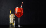 Fototapeta  - Aperol spritz and gin tonic cocktails