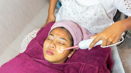 facial treatment with laser and ultrasound in a medical spa center skin rejuvenation concept