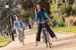 © Westend61 - Carefree woman cycling with boyfriend at park