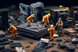 miniature construction workers on top of a piece of metal with tools