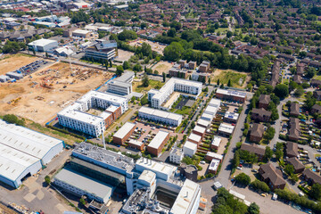 Wall Mural - Aerial photo of the British town of Stevenage in Hertfordshire UK showing a typical British housing estate with rows of houses in the village, on a hot sunny summers day.