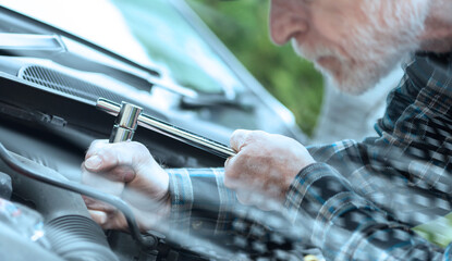 Wall Mural - Car mechanic working on car engine; light effect