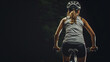Full body shot of 30 year old woman runner on cycling track and bike on black background.