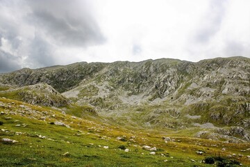 Beautiful shot of mountains against a cloudy sky during the daytime