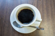 Black americano coffee on wooden table