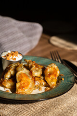 Poster - Fried dumplings with sour cream and crispy onions