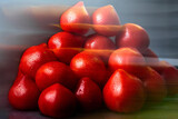 Fototapeta Konie - Heap of red, fresh, aromatic, ripe tomatoes with water drops on a dark background