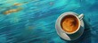 A cup of liquid in a saucer sitting on a vibrant electric blue table, resembling an astronomical object in a circle. A beautiful blend of art and science