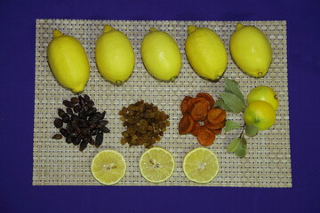 Food concept. Yellow lemon. White raisins. black raisins. Bay leaf. For making soup, salad.	