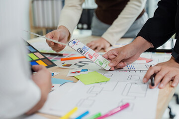 Wall Mural - ui designer and ux developer brainstorm idea to design the application interface. creative digital d