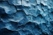 The image presents a close-up detail of a cracked stone texture with various hues of blue, creating an abstract icy appearance