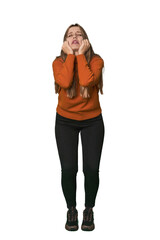 Wall Mural - Studio portrait of a blonde Caucasian woman crying, unhappy with something, agony and confusion concept.