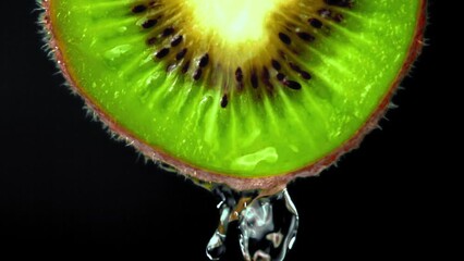 Sticker - Super slow motion with a round piece of kiwi escapes the water. Filmed on a high-speed camera at 1000 fps. High quality FullHD footage