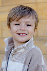 Wall Mural - a young boy with a sweater that says quot he's smiling quot