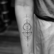 Monochrome tattoo of a minimalist, symbolic geometric icon or glyph tattoo design