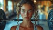 © Wiseman - A person using a barbell in a fitness studio.