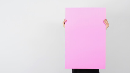 Wall Mural - The blank pink color paper in man hand on white background.