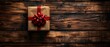 The Christmas season is in full swing. A vintage-style gift box is perched on wooden planks on a background with an empty space for a photo or text. The top of the box shows a copy space.