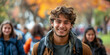 Happy Young Man with Backpack Enjoying Autumn on Campus