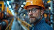 A serious-faced engineer wearing a hard hat and glasses stands in an industrial setting with machinery in the background. Generative AI