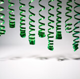 Fototapeta  - decorative green spiral ribbon on grey background