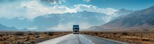 Lone Semi Truck Dominates The Mountainous Highway Under The Vast Open Sky Transporting Cargo Through The Rugged And Dramatic Landscape