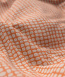 Orange and white patterned crumpled blanket rug 3d render