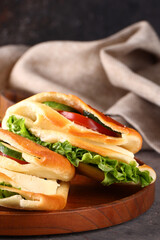 Wall Mural - sandwiches with salad, cheese and vegetables for lunch