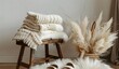 Cozy winter atmosphere: knitted baby booties on a wooden stool, enveloping in warmth and comfort, illuminated by soft natural light
