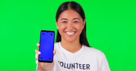 Poster - Phone, green screen and portrait of volunteer woman with charity website fund information mockup. Asian person hand with smartphone and tshirt for nonprofit contact, NGO or donation tracking markers