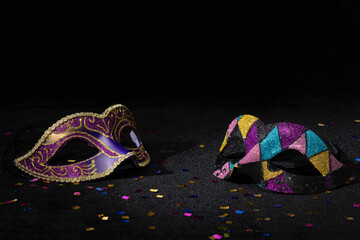 Venetian Masquerade masks on black background. Carnival party layout.