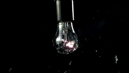Super slow motion light bulb exploded. . High quality FullHD footage