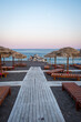 sun loungers on a beach resort in Santorini, Greece