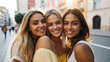 Multicultural female friends having fun on vacation hanging outdoor - Friendship and happy lifestyle concept,isolated on city blur background.