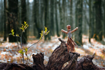 magic witchcraft doll made of tree bast in autumn forest, natural background. Forest grandmother, defender guardian spirit of nature. old pagan Wiccan, Slavic tradition. esoteric spiritual ritual