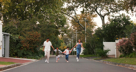 Poster - Family, parents and kids in street, skipping and playful with love, care or holding hands in neighborhood. Happy man, woman and children with funny walk, excited and playing outdoor in road in summer