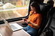 Business woman working while traveling by train 