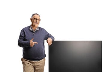 Poster - Mature man pointing a tv flat hd screen